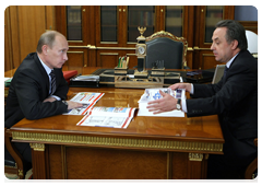 Prime Minister Vladimir Putin with Vitaly Mutko, Minister of Sport, Tourism and Youth Policy
