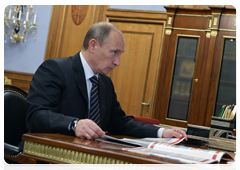 Prime Minister Vladimir Putin with Vitaly Mutko, Minister of Sport, Tourism and Youth Policy