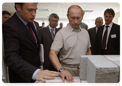 Vladimir Putin visiting Kotelnikovo after touring the Gremyachin potassium salt deposits