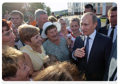Prime Minister Vladimir Putin visiting a church in the village of Tulinovka