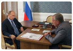 Prime Minister Vladimir Putin at a work meeting with Novgorod Region Governor Sergei Mitin