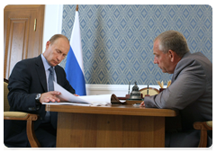 Prime Minister Vladimir Putin at a work meeting with Novgorod Region Governor Sergei Mitin
