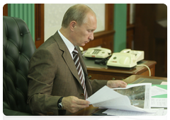 Prime Minister Vladimir Putin during a conference call on measures to reduce the incidence of wildfires
