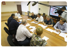 Prime Minister Vladimir Putin chairing a meeting on the nationwide wildfire emergency while visiting the Nizhny Novgorod Region