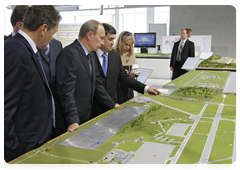 Prime Minister Vladimir Putin inspecting plans for airport construction and renovation during his visit to North Caucasus Federal District