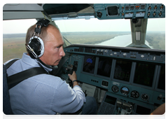 Prime Minister Vladimir Putin helping extinguish forest fires from aboard a Be-200 amphibious aircraft