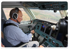 Prime Minister Vladimir Putin helping extinguish forest fires from aboard a Be-200 amphibious aircraft