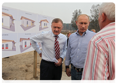 Prime Minister Vladimir Putin reviewing the plan for rebuilding the village of Kriusha in the Ryazan Region