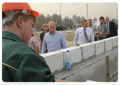 Prime Minister Vladimir Putin inspecting construction sites where houses destroyed by fire are being rebuilt in the village of Kriusha in the Ryazan Region