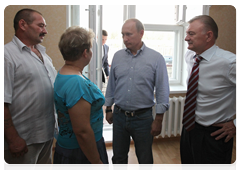 Prime Minister Vladimir Putin visiting a new house in the village of Polyana in the Ryazan Region