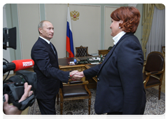 Prime Minister Vladimir Putin discussing the current harvesting campaign and the harvest forecast with Minister of Agriculture Yelena Skrynnik
