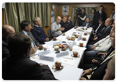 Prime Minister Vladimir Putin on board the trawler Mikhail Staritsyn for an informal meeting with fishermen