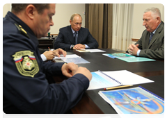 Prime Minister Vladimir Putin meeting with the Governor of the Kamchatka Territory Alexei Kuzmitsky, head of the Far Eastern Department of the Federal Agency for State Reserves Alexander Savchenko and head of the Far Eastern Centre of the Emergencies Ministry Yury Naryshkin