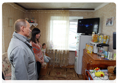 Prime Minister Vladimir Putin visiting a local hostel in Petropavlovsk-Kamchatsky
