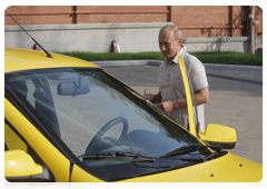 Prime Minister Vladimir Putin driving a Lada Kalina car down the new Khabarovsk – Chita motorway