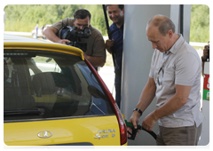 Prime Minister Vladimir Putin stopping at a petrol station on the road from Khabarovsk to Chita