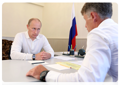 Prime Minister Vladimir Putin at a working meeting with Amur Region Governor Oleg Kozhemyako during his tour of the Far Eastern Federal District
