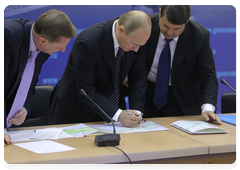 Prime Minister Vladimir Putin chairing a meeting in Chita to discuss road construction
