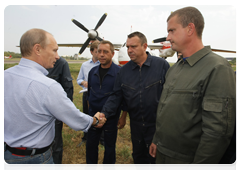 Prime Minister Vladimir Putin meeting with crews of Russian and Ukrainian firefighting air units