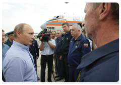 Prime Minister Vladimir Putin meeting with crews of Russian and Ukrainian firefighting air units