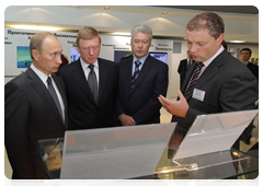 Prime Minister Vladimir Putin looking at RusNano products