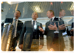 Prime Minister Vladimir Putin looking at RusNano products