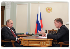 Prime Minister Vladimir Putin at a meeting with Sergei Vasilyev, the director of the Federal Service of State Registration, Cadastre and Cartography and the main state registrar of the Russian Federation