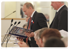 Prime Minister Vladimir Putin giving a speech at the General Council meeting of the Federation of Independent Trade Unions of Russia