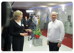 Prime Minister Vladimir Putin visiting the Baltic Media Group’s public reception room in St Petersburg
