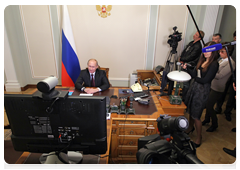 Prime Minister Vladimir Putin holding a video conference with Khabarovsk, where the Amur highway has been completed