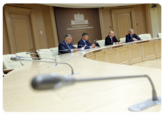 Prime Minister Vladimir Putin during a video conference on relocating tenants living in dilapidated and hazardous housing in Tynda