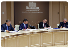 Prime Minister Vladimir Putin during a video conference on relocating tenants living in dilapidated and hazardous housing in Tynda