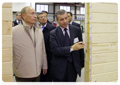 Prime Minister Vladimir Putin visiting the Syktyvkar industrial complex which specializes in woodworking and the construction of wooden buildings