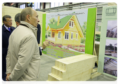 Prime Minister Vladimir Putin visiting the Syktyvkar industrial complex which specializes in woodworking and the construction of wooden buildings