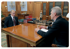 Prime Minister Vladimir Putin holding a working meeting with Education and Science Minister Andrei Fursenko