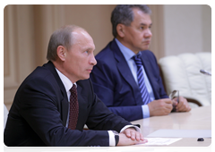 Prime Minister Vladimir Putin and Emergencies Minister Sergei Shoigu at the video conference on combating wildfires in the Altai Territory and providing relief to the population