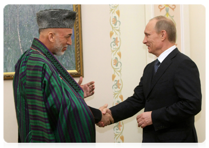 Prime Minister Vladimir Putin meets with Afghan President Hamid Karzai