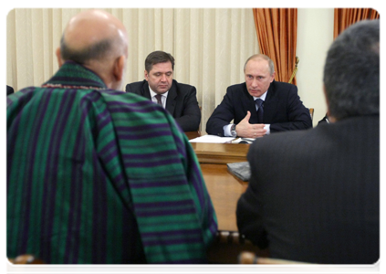 Prime Minister Vladimir Putin meets with Afghan President Hamid Karzai