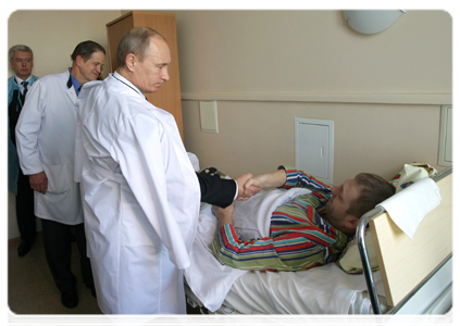 Prime Minister Vladimir Putin visiting Domodedovo terrorist attack victims at the Vishnevsky Surgery Institute