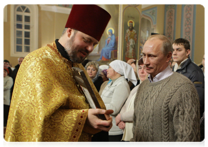 Prime Minister Vladimir Putin presenting an icon of the Mother of God by an unknown master