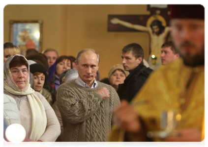 Prime Minister Vladimir Putin attending Christmas service at the church of the Protecting Veil of the Mother of God in the village of Turginovo, Tver Region