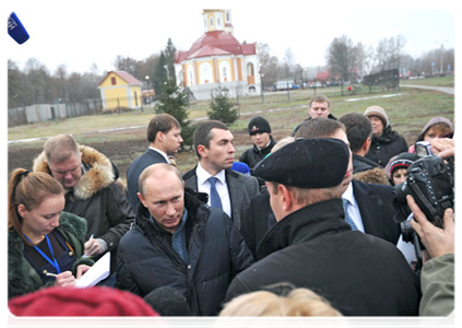 Prime Minister Vladimir Putin meeting with local residents during his visit to the village of Golovchino