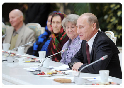 President Dmitry Medvedev and Prime Minister Vladimir Putin meeting with pensioners and veterans in the Grand Kremlin Palace