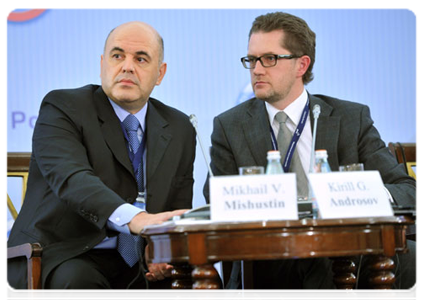 Federal Tax Service head Mikhail Mishustin and Deputy Chief of the Government Staff Kirill Androsov at international conference, Thinking of Taxes in a New Way
