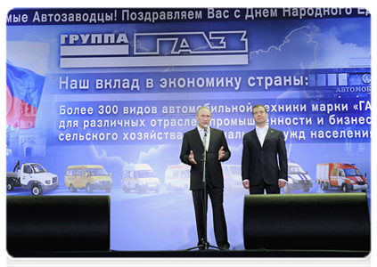 President Dmitry Medvedev and Prime Minister Vladimir Putin take part in a concert commemorating National Unity Day