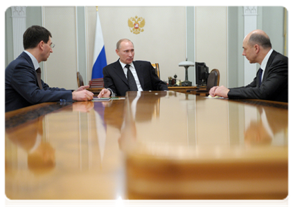Prime Minister Vladimir Putin meeting with Finance Minister Anton Siluanov and Minister of Communications and Mass Media Igor Shchegolev