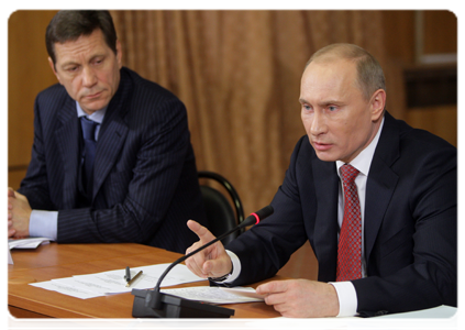 Prime Minister Vladimir Putin and Deputy Prime Minister Alexander Zhukov at a meeting on modernising Moscow's healthcare system in 2011 and 2012