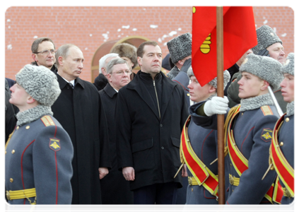 Prime Minister Vladimir Putin and President Dmitry Mevedev attend the wreath-laying ceremony at the Tomb of the Unknown Soldier in Alexander Garden