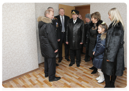 Prime Minister Vladimir Putin inspects a flat in a new building in Kaliningrad, which is being developed for Baltic Fleet officers
