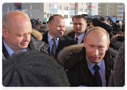 Prime Minister Vladimir Putin talks with residents of the Severny residential district